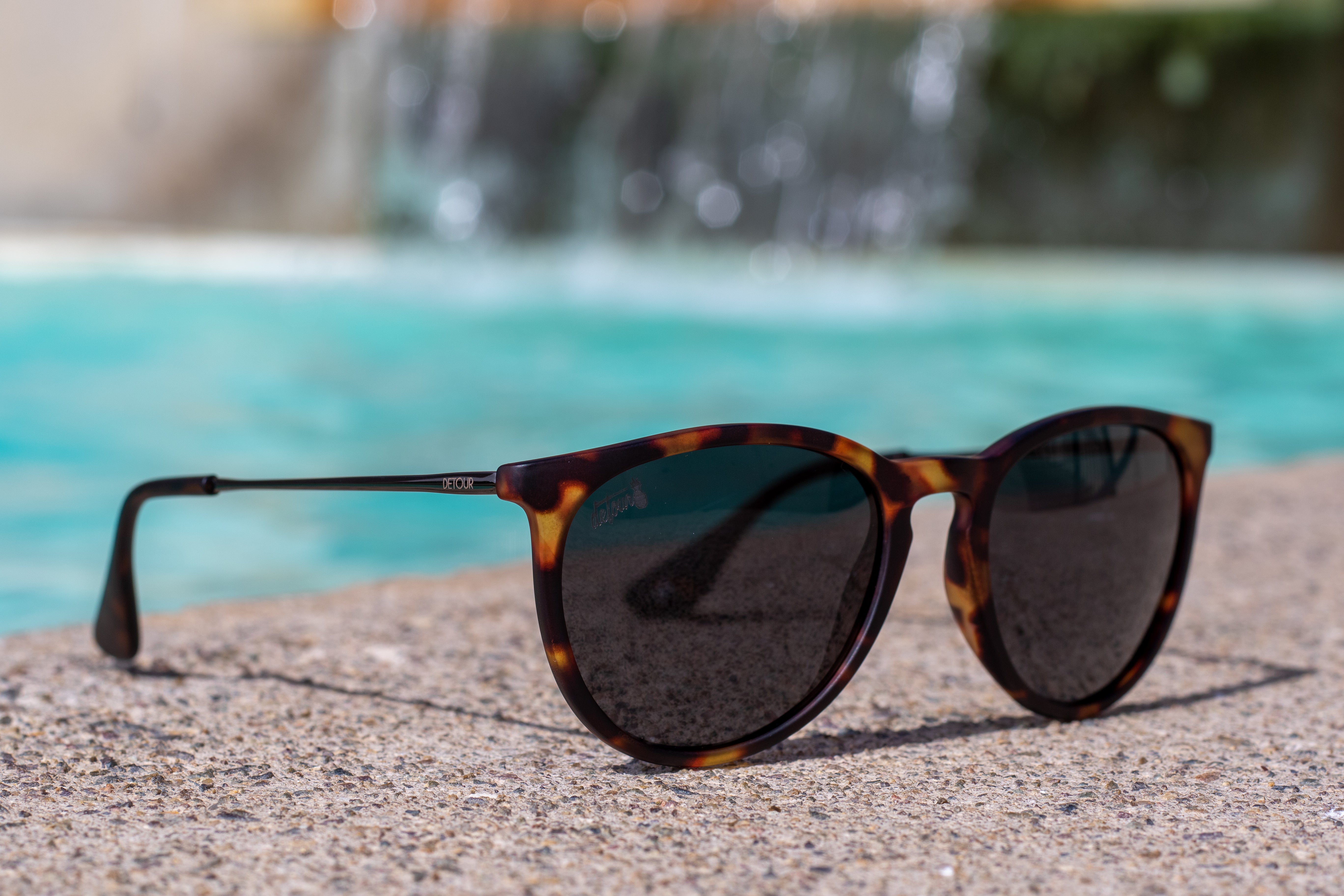 Snowboarder carving through powder in snowy terrain.