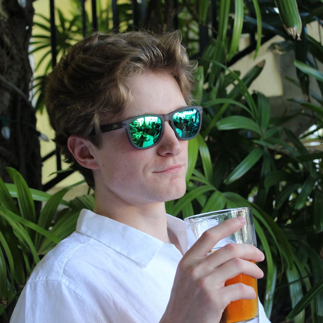 Snowboarder carving through powder in snowy terrain.